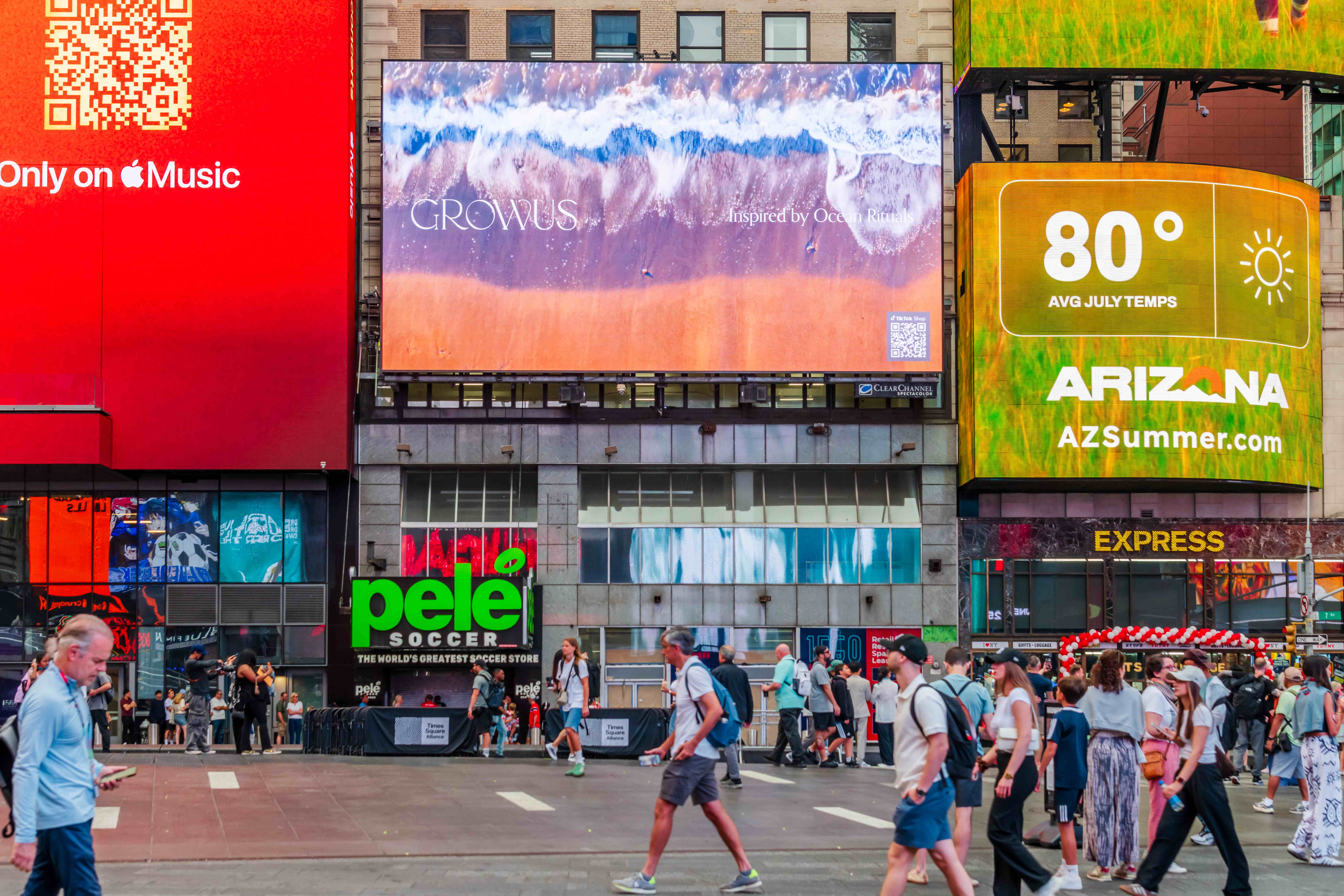 GROWUS "Inspired by Ocean Rituals" creative on the 1560 Broadway digital billboard above Times Square crowds, New York