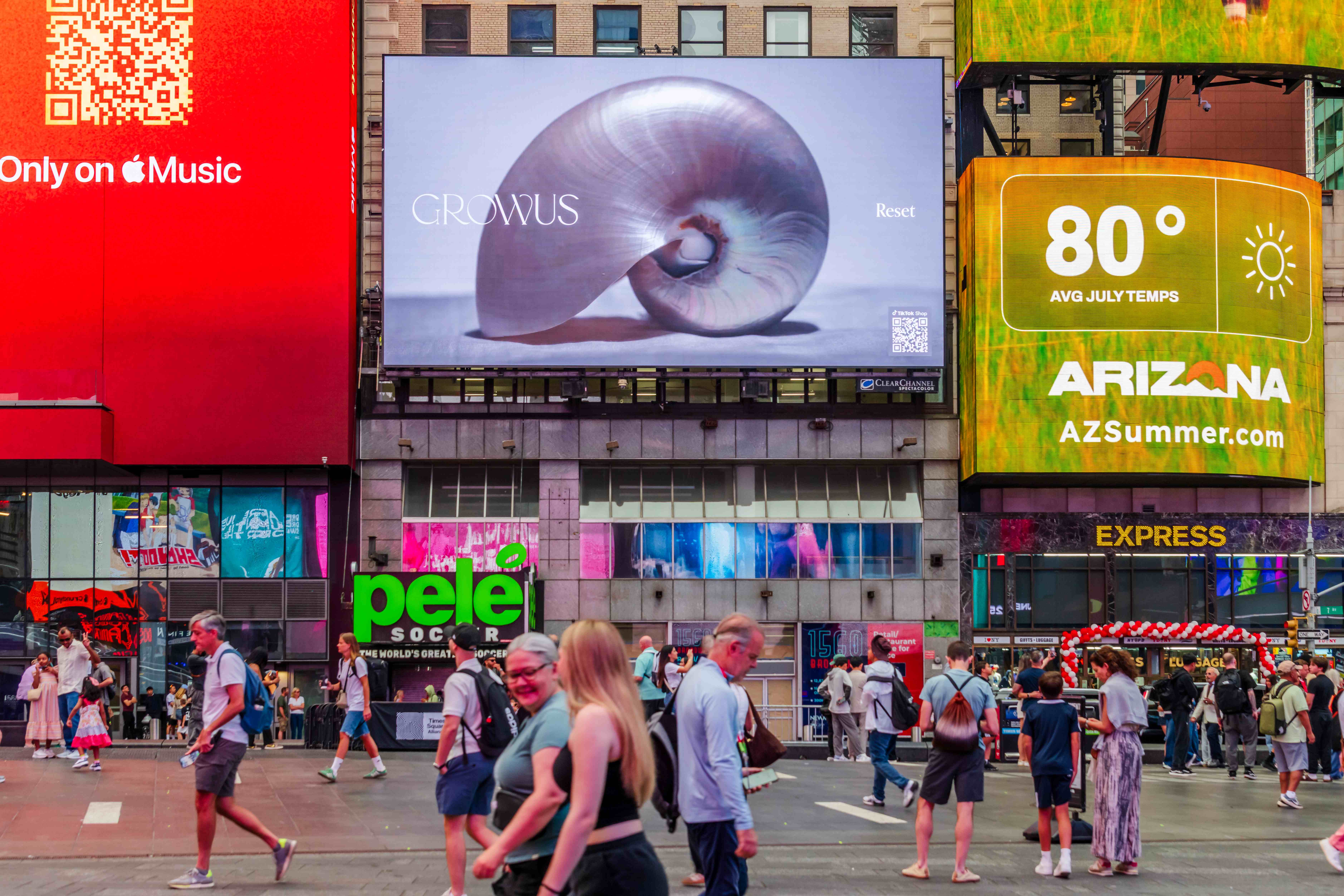 GROWUS "Reset" creative featuring a nautilus shell on the Times Square billboard