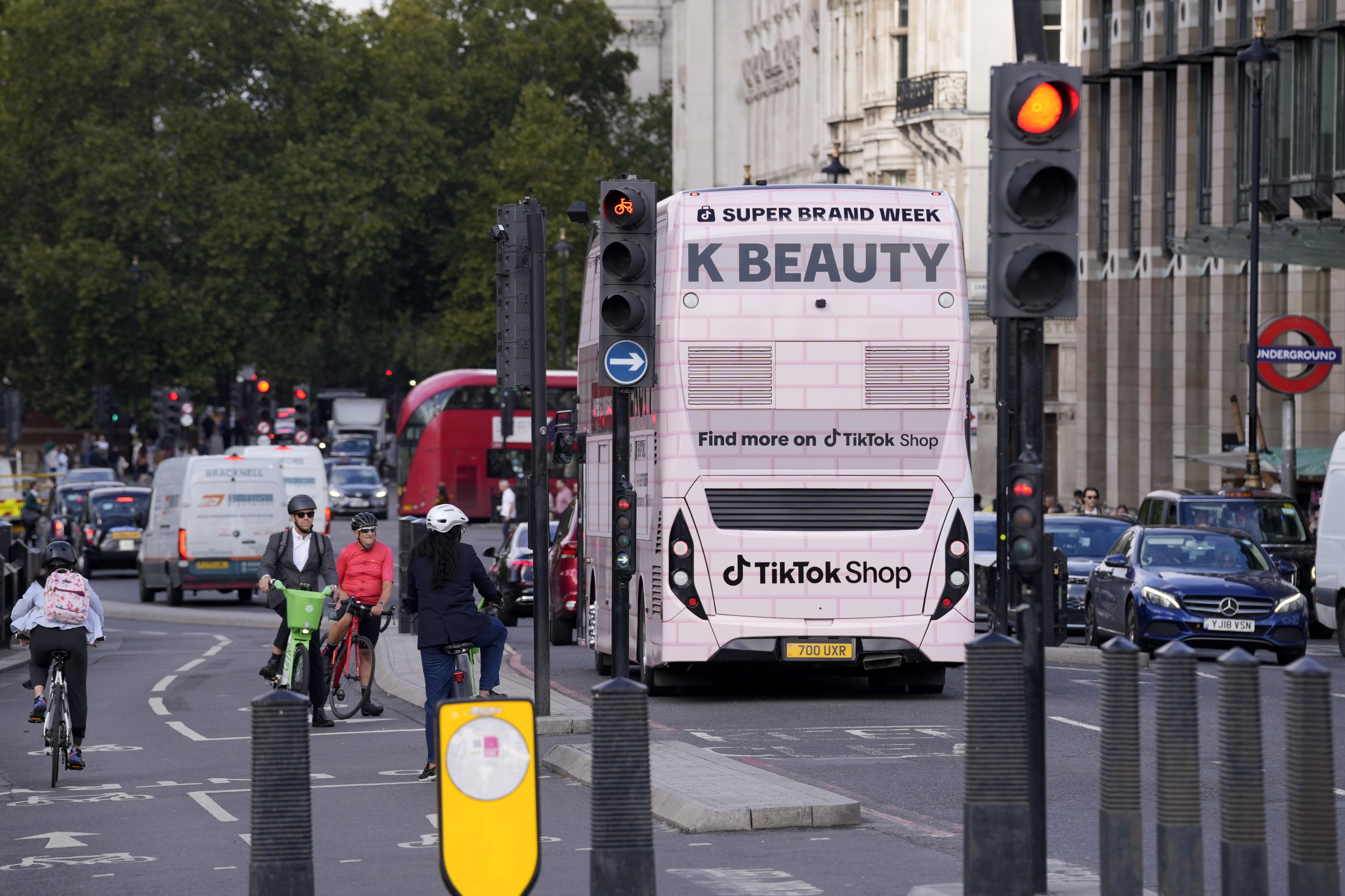 Rear of the K-BEAUTY bus in Westminster traffic, "Find more on TikTok Shop"