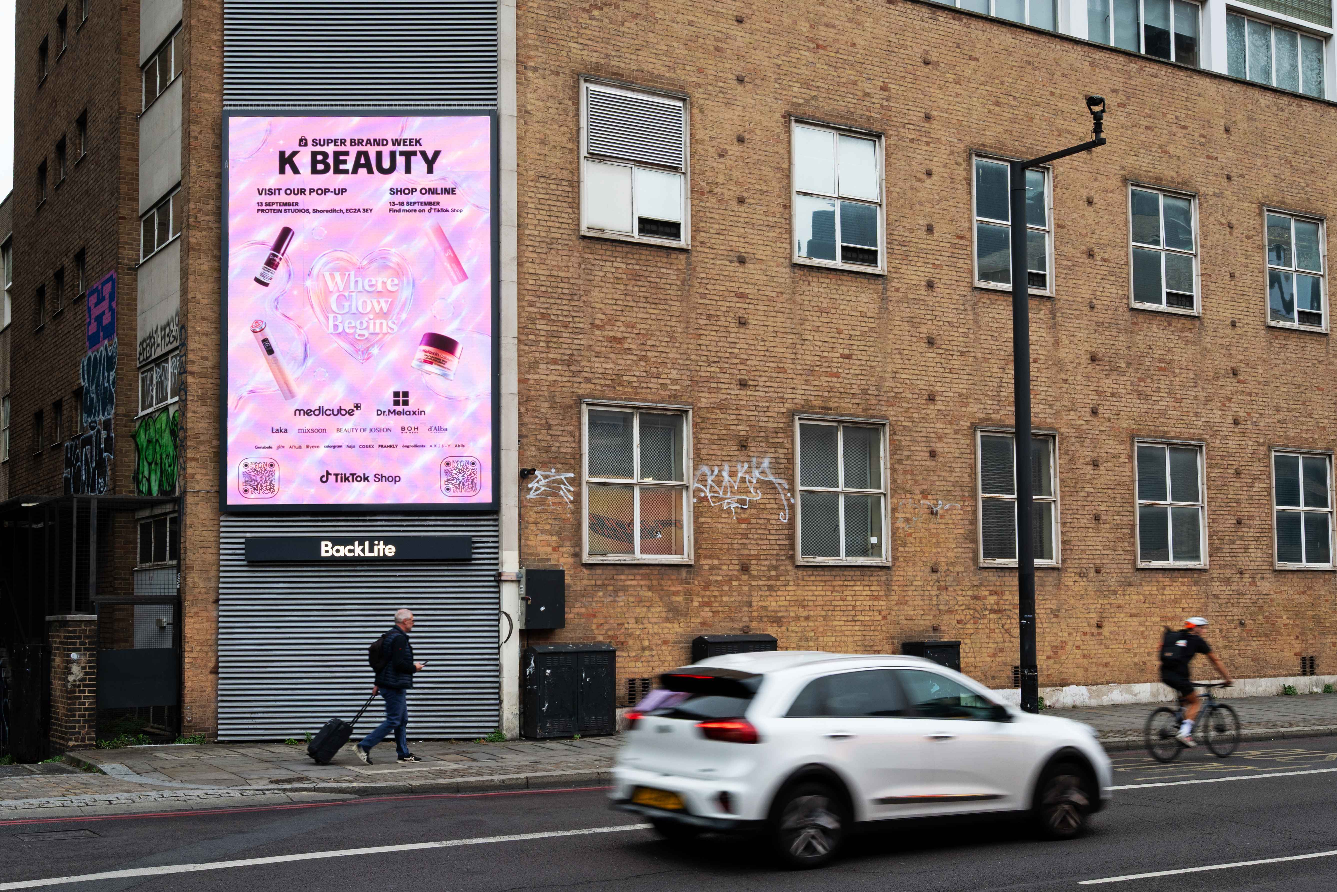 Large-format digital screen in Shoreditch showing the TikTok Shop K-BEAUTY campaign