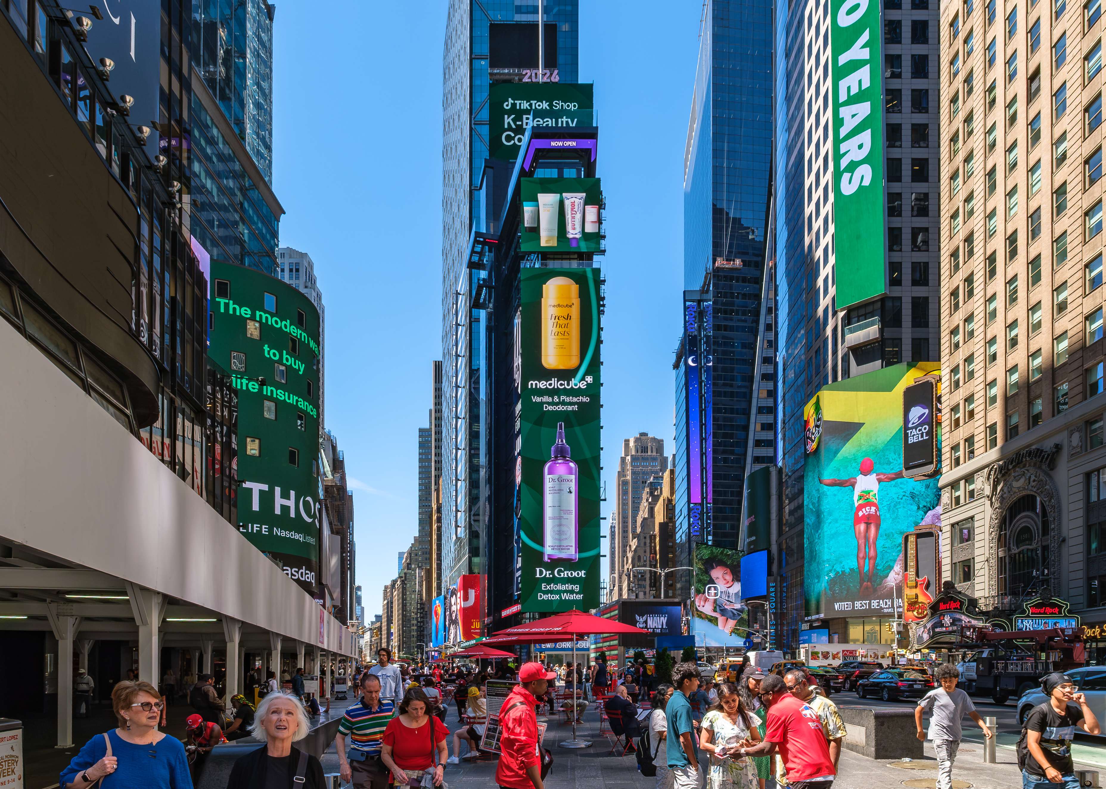 TikTok Shop K-Beauty Collective medicube and Dr. Groot creatives on the vertical Times Square digital screens above the pedestrian plaza, New York